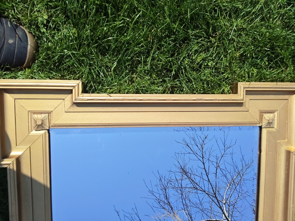 A rectangular Victorian giltwood wall mirror featuring stepped architectural corners and square raised corner bosses. View III