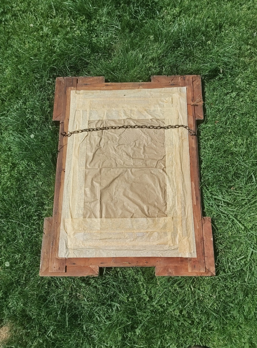 A rectangular Victorian giltwood wall mirror featuring stepped architectural corners and square raised corner bosses. View VII