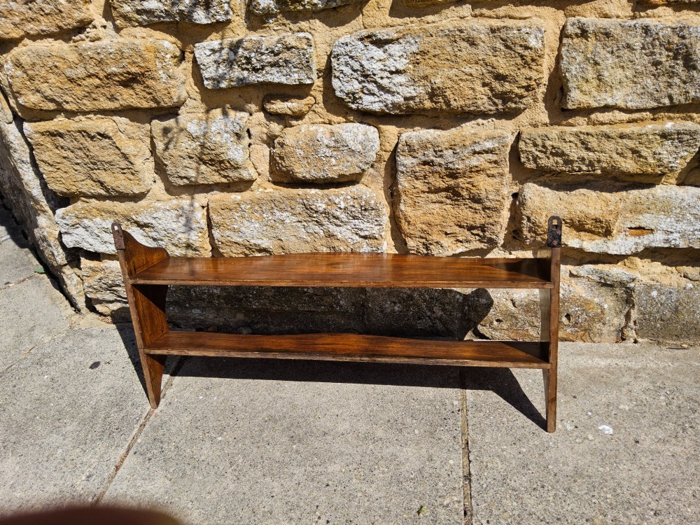 A 19th-century dark walnut wall shelf unit featuring two tiers and shaped serpentine side supports. View VIII