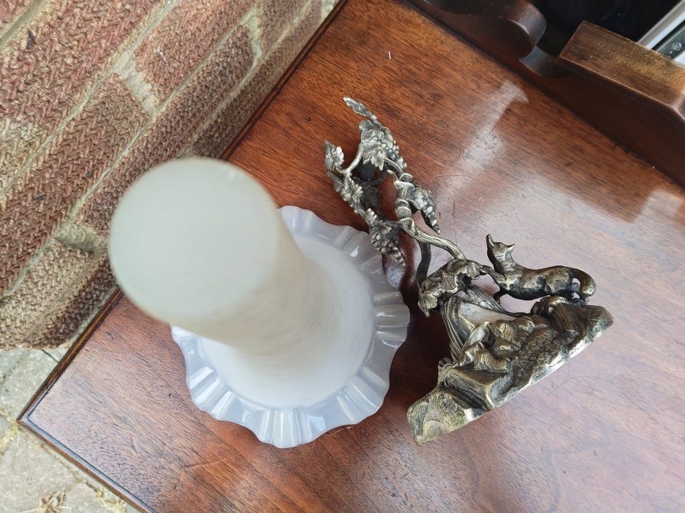 A Victorian white metal epergne base depicting a fox and grapes motif holding a frosted opaque glass trumpet vase with a ruffled rim. View IX