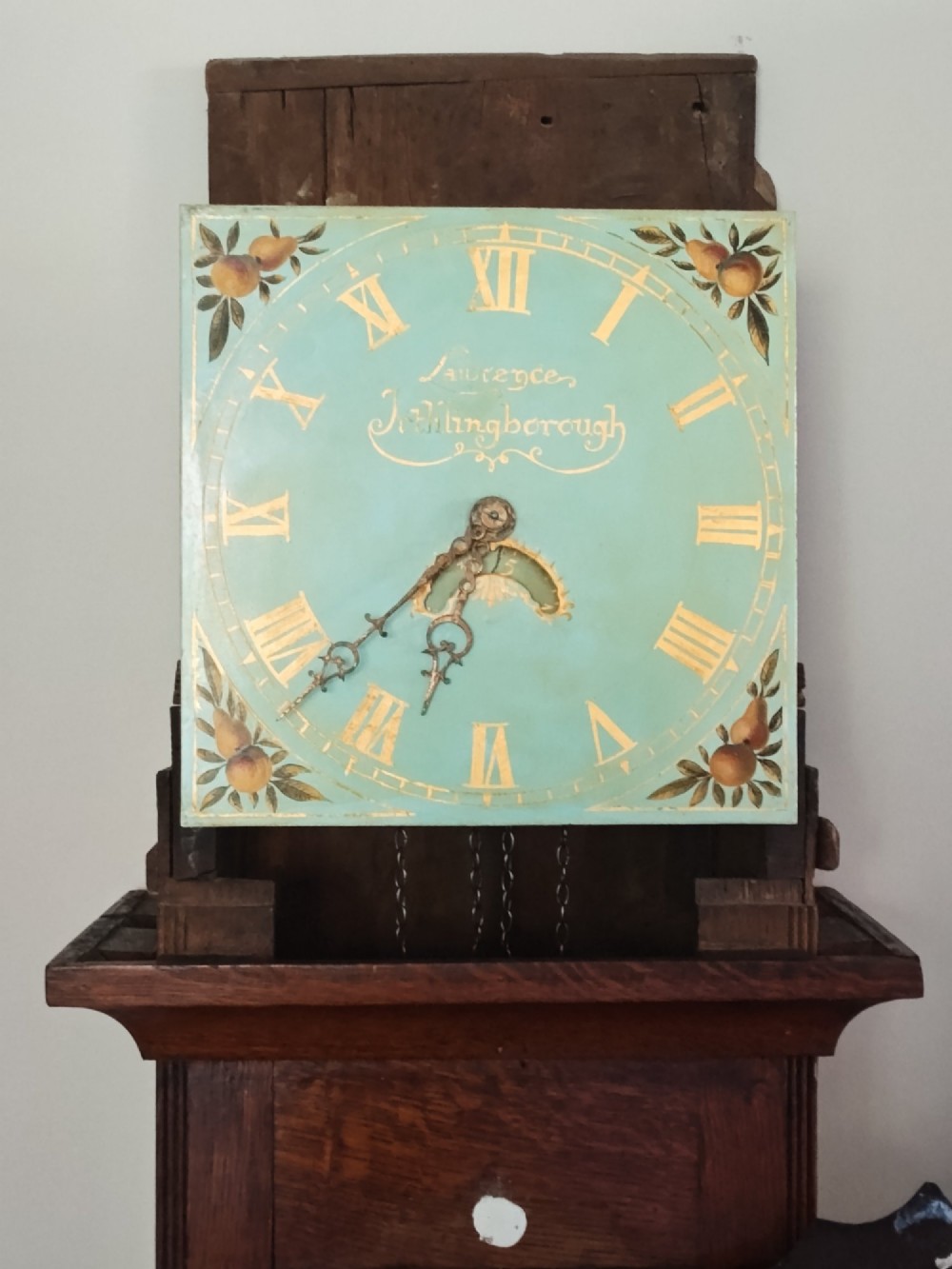 A Georgian oak longcase clock featuring a swan-neck pediment, arched trunk door, and a painted duck egg blue square dial with Roman numerals. View XI
