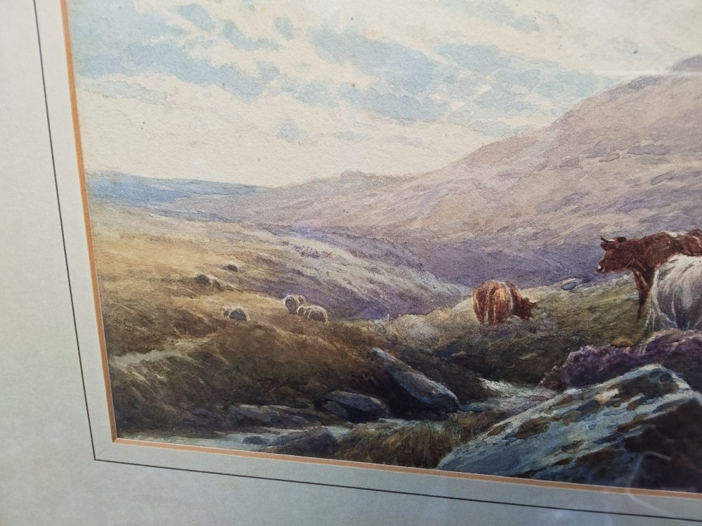 A framed horizontal watercolour painting depicting cattle and sheep grazing in a rugged moorland landscape under a cloudy sky. View IV