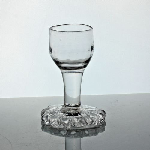 GEORGIAN PLAIN STEM FIRING DRAM GLASS WITH AN OVERSEWN FOOT - ADDITIONAL PHOTO 1