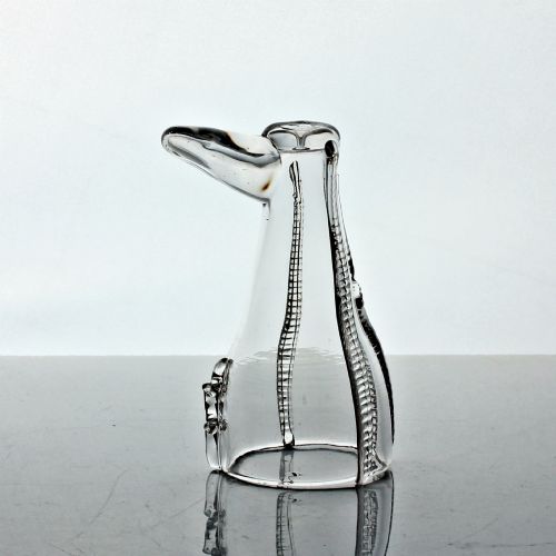 fig 1. A clear hand-blown Georgian glass vessel modelled in the shape of a boot with vertical rigaree decoration.