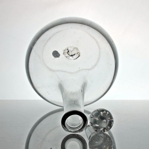 fig 2. An 18th-century Georgian clear hand-blown glass shaft and globe decanter featuring a spherical base, long slender neck, and matching glass ball stopper.