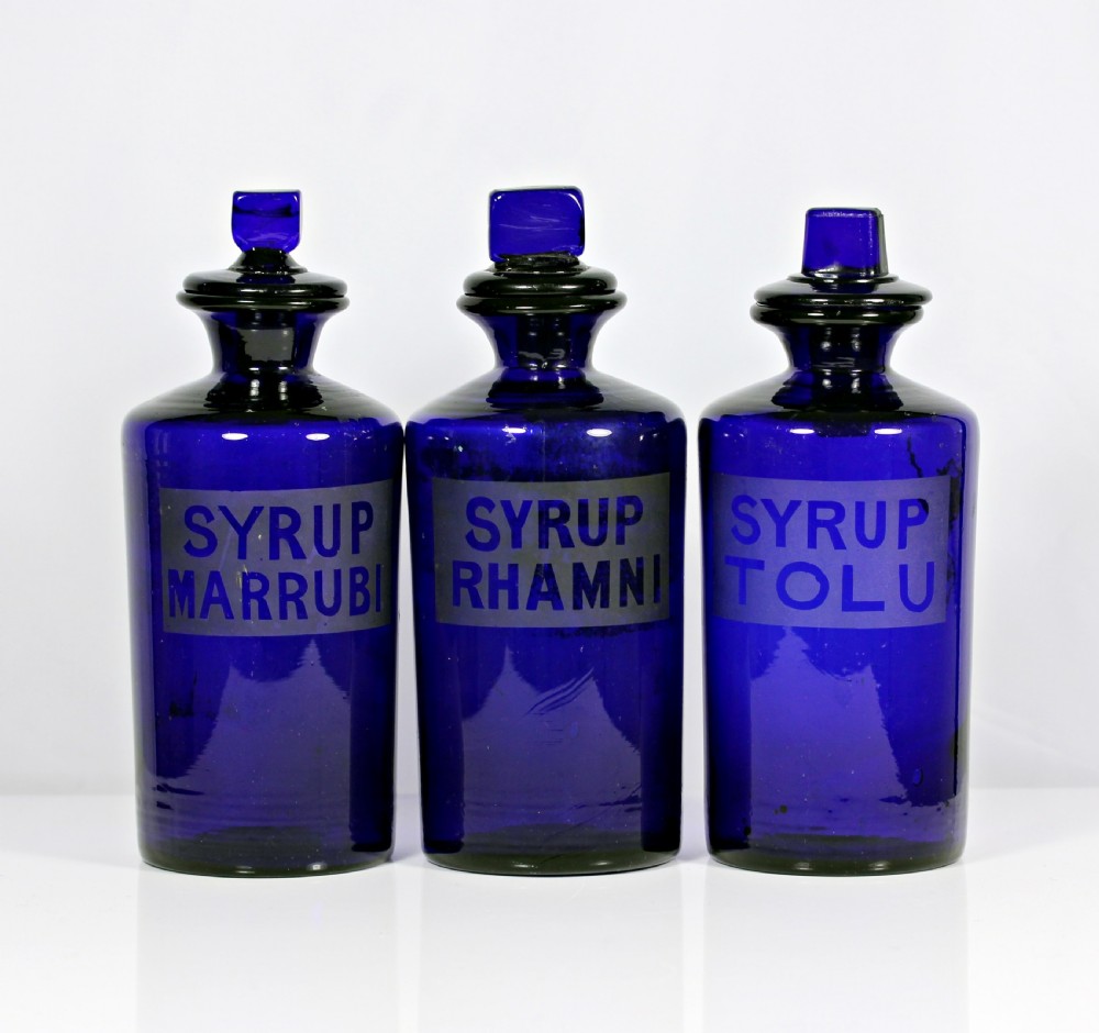 Set of three late Victorian Bristol blue apothecary bottles