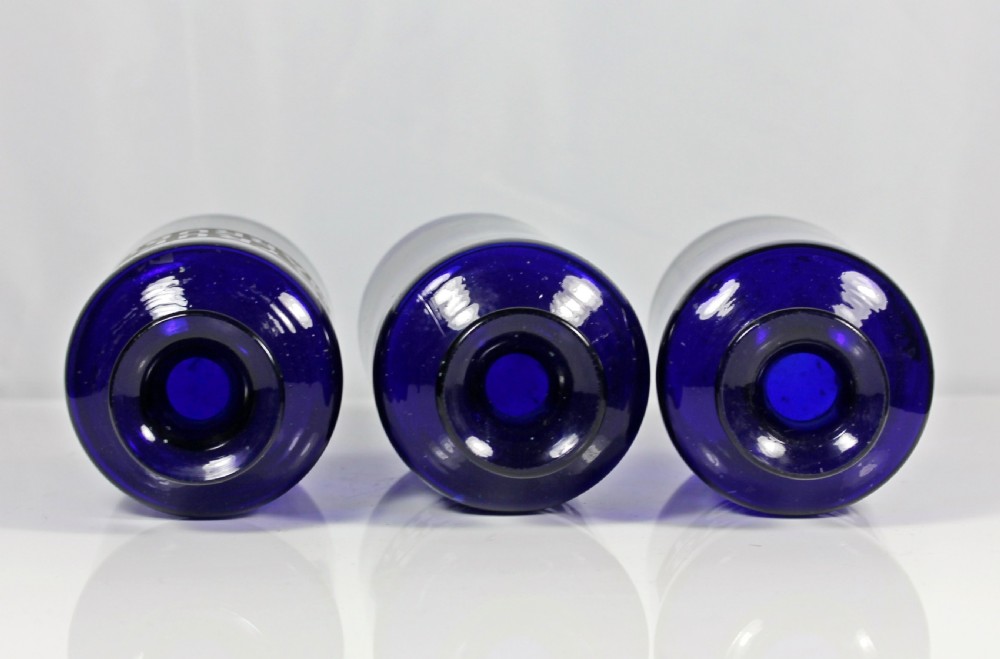 Set of three late Victorian Bristol blue apothecary bottles View II