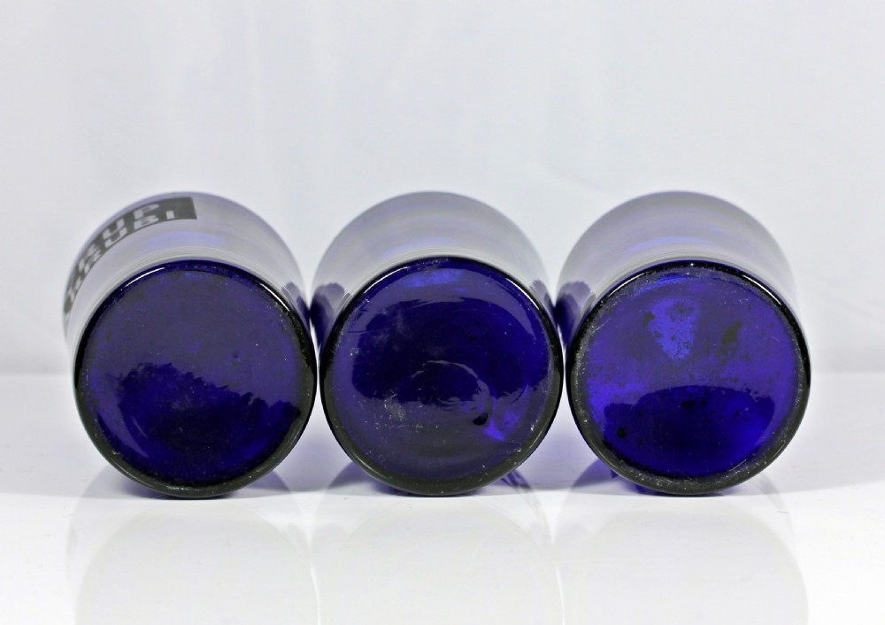 Set of three late Victorian Bristol blue apothecary bottles View IV