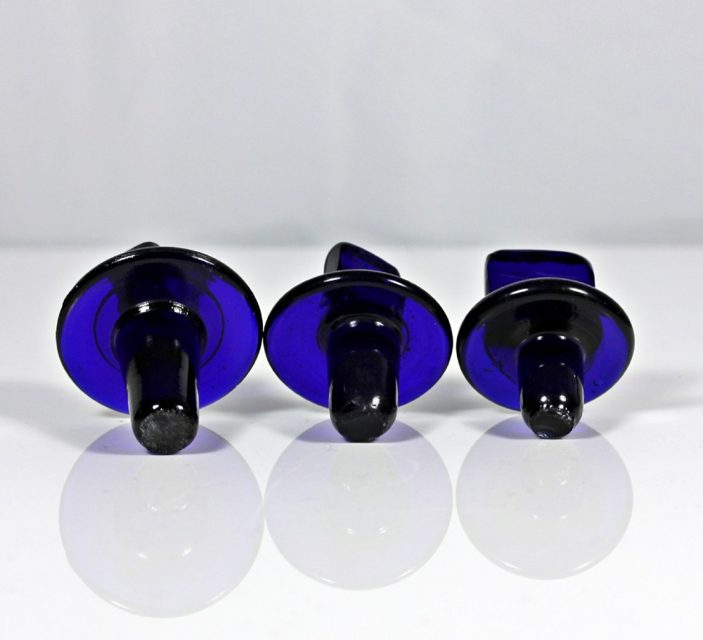 Set of three late Victorian Bristol blue apothecary bottles View V