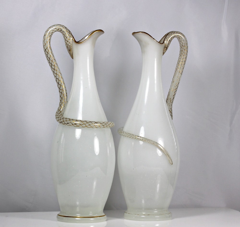 Pair of Richardsons of Stourbridge white opaline, mouth-blown, snake-handled glass ewers