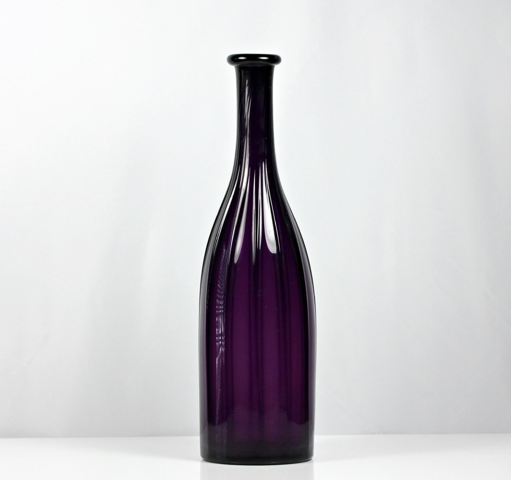 George IV, mouth-blown rib-moulded glass spirit bottle, amethyst
