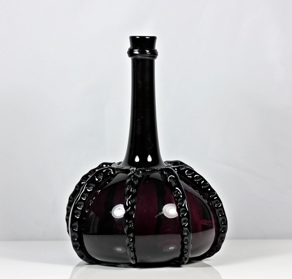 Georgian amethyst Dutch decanter with rigaree decoration