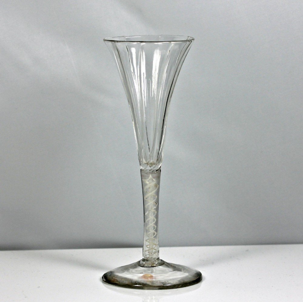 Georgian rare double series opaque twist wine flute, rib-moulded trumpet bowl