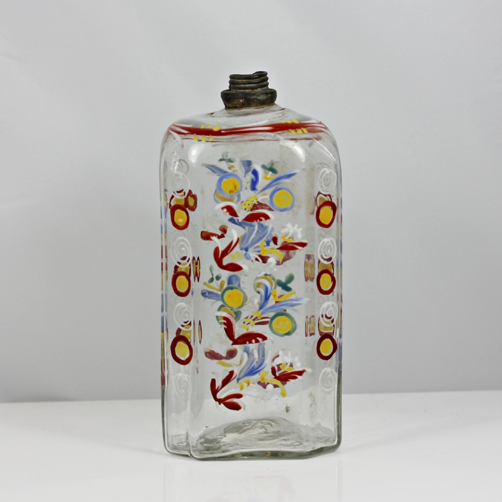An 18th-century rectangular clear glass schnapps flask featuring hand-painted polychrome floral enamelling and a threaded metal pewter cap. View III