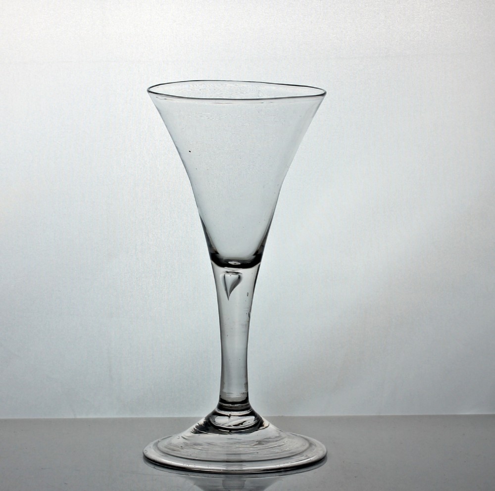 Georgian trumpet bowl plain stem wine glass, air tear, folded foot