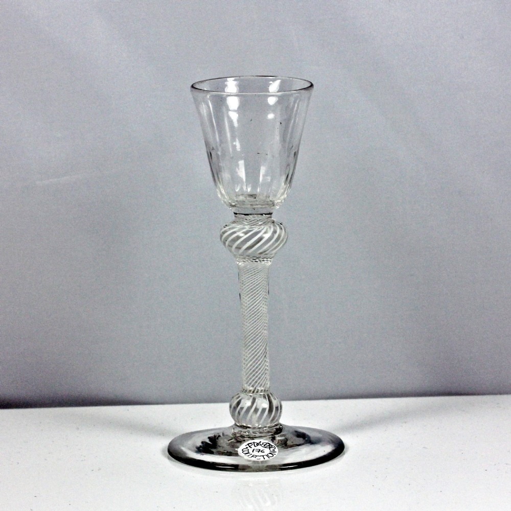 Georgian multi spiral opaque twist wine glass, double knop
