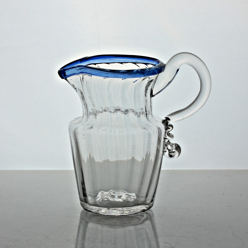 Georgian large panel-moulded cream jug with blue glass rim