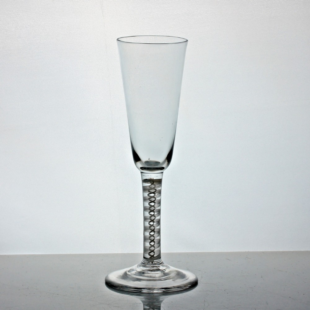 An eighteenth-century Georgian ale glass featuring a tall conical bowl, an opaque white double-twist stem, and a circular conical foot. View II