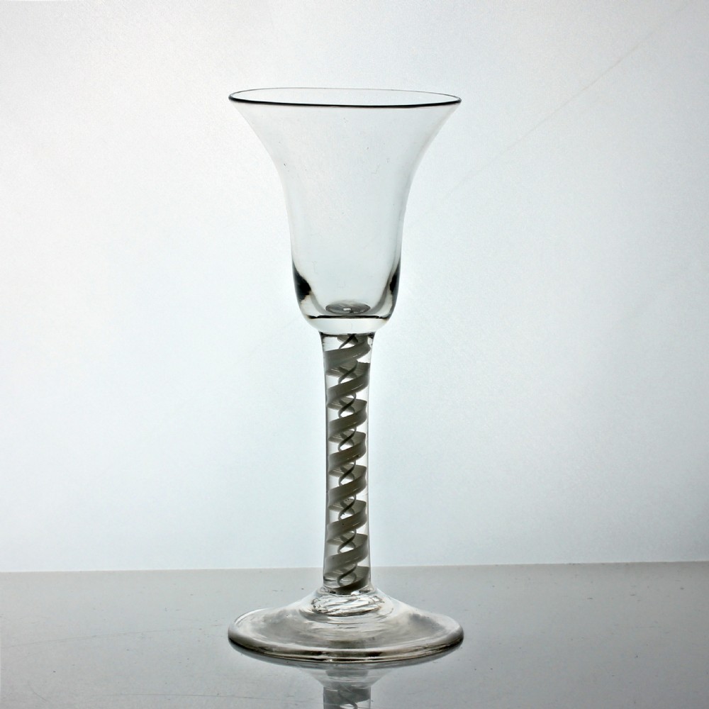 A Georgian clear glass wine glass featuring a flared bell bowl and an internal double series white opaque twist stem. View III