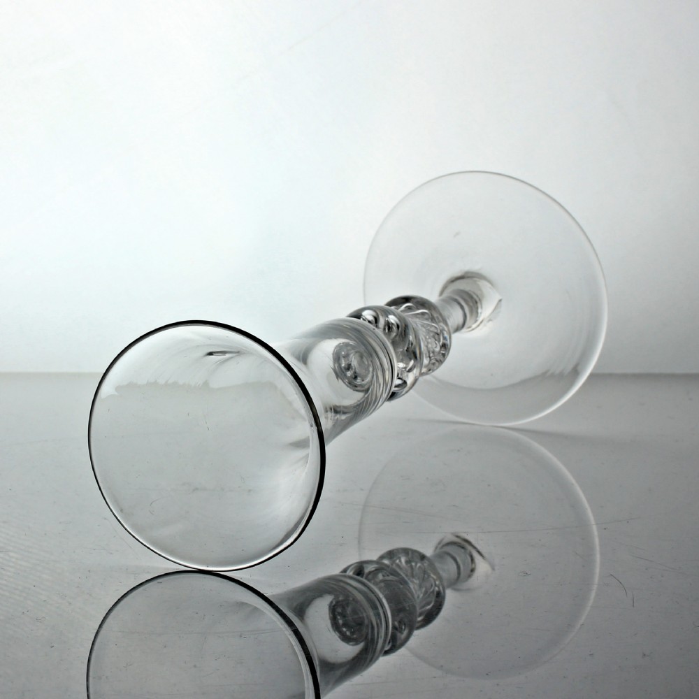 A clear Georgian air twist ale glass featuring a bell-shaped bowl, a double knopped stem with internal air spirals, and a conical foot. View IV