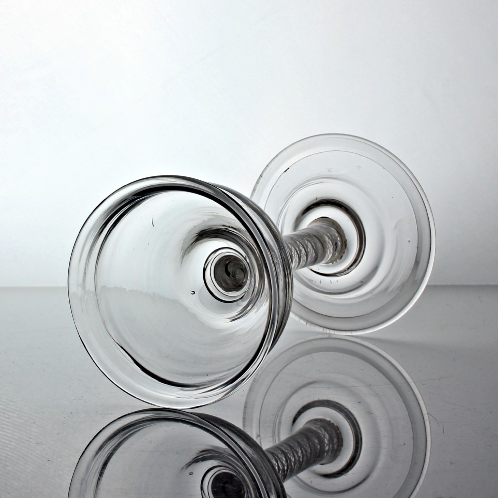 A clear Georgian lead glass coupe featuring a double series opaque twist stem set on a circular foot. View III