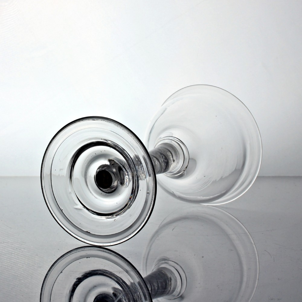 A clear Georgian lead glass coupe featuring a double series opaque twist stem set on a circular foot. View IV