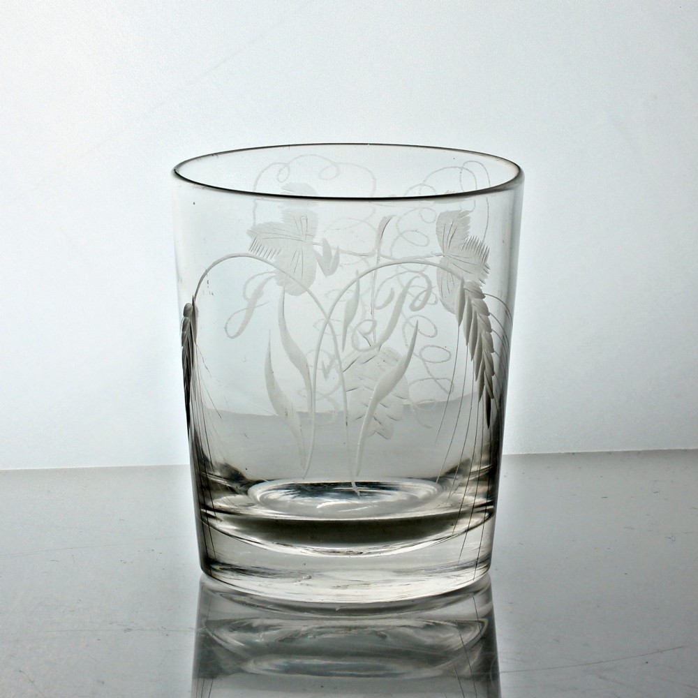A clear Georgian glass tumbler featuring wheel-engraved motifs of hops and barley around its cylindrical body. View II