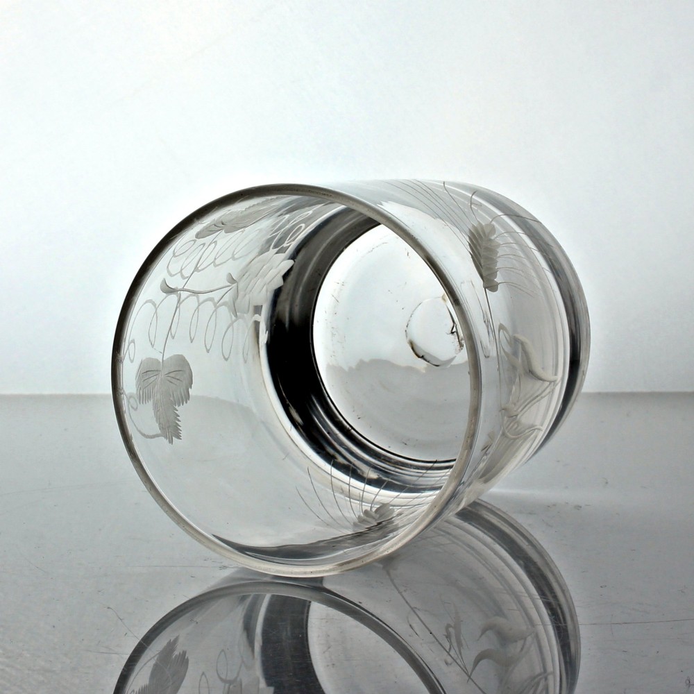 A clear Georgian glass tumbler featuring wheel-engraved motifs of hops and barley around its cylindrical body. View III