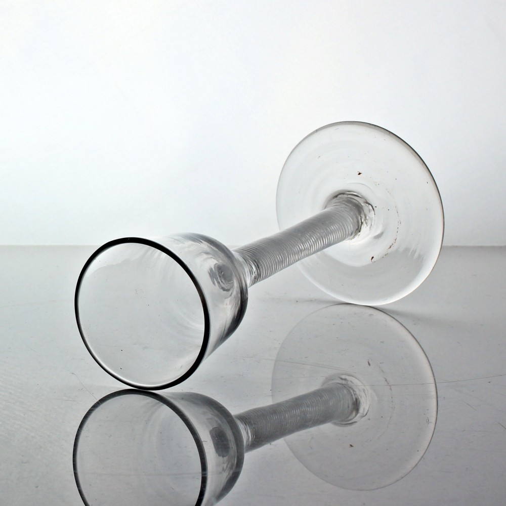 A clear Georgian wine glass featuring an ogee-shaped bowl, a multi-spiral air twist stem, and a flat circular foot. View II