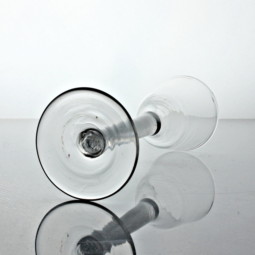 A clear Georgian wine glass featuring an ogee-shaped bowl, a multi-spiral air twist stem, and a flat circular foot. View III