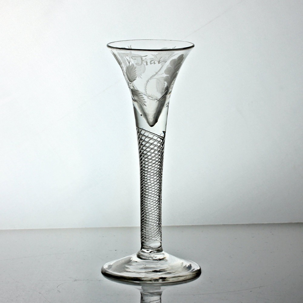 A clear Georgian air twist wine glass featuring a trumpet-shaped bowl with wheel-engraved rose motifs and a multi-spiral twist stem. View III