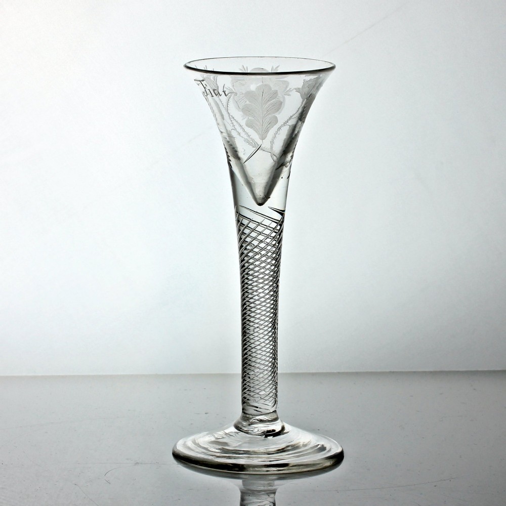 A clear Georgian air twist wine glass featuring a trumpet-shaped bowl with wheel-engraved rose motifs and a multi-spiral twist stem. View IV