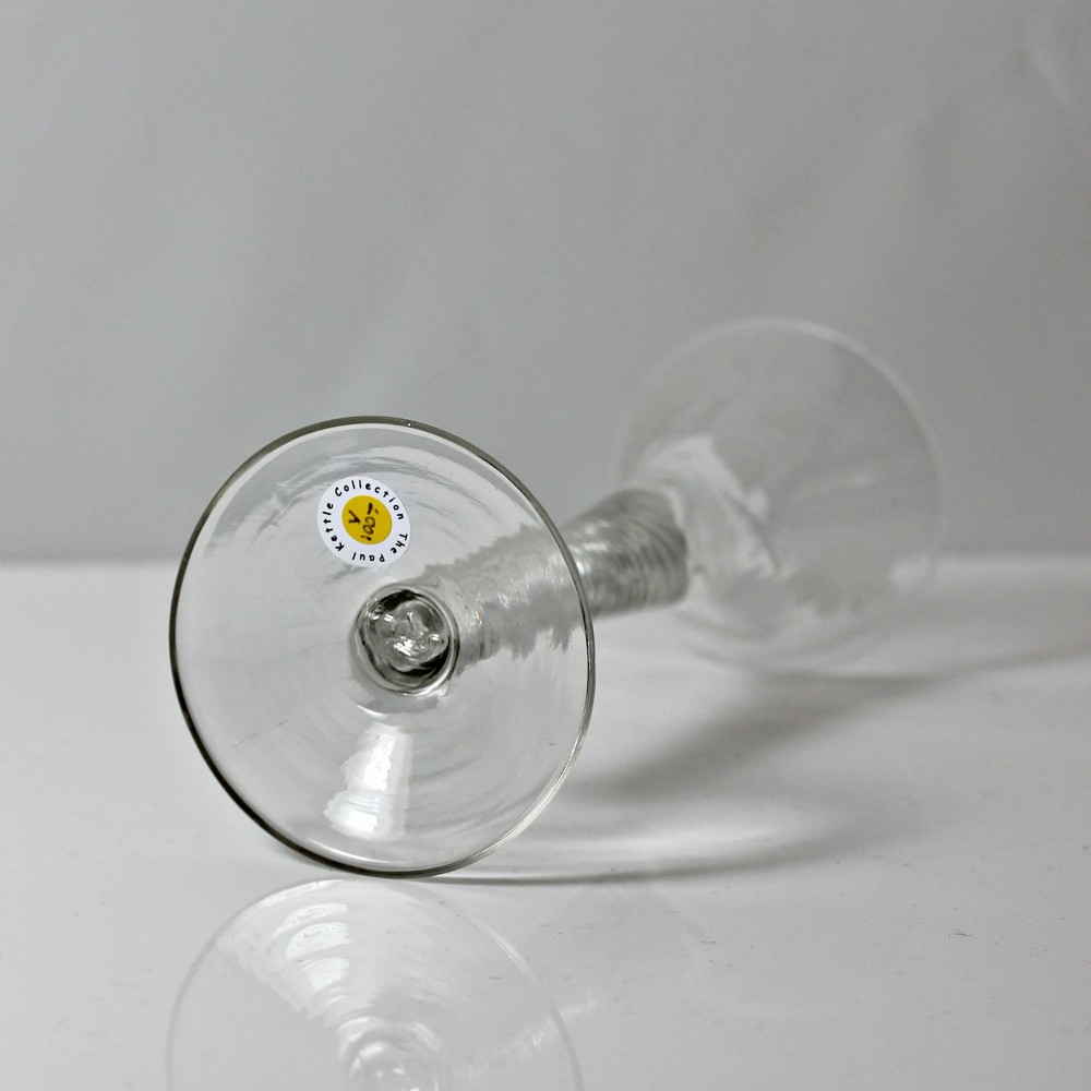 A clear Georgian air twist wine glass featuring a trumpet-shaped bowl with wheel-engraved rose motifs and a multi-spiral twist stem. View VIII