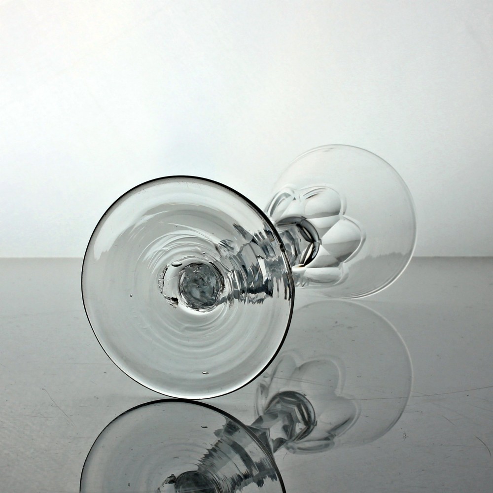 A Georgian clear glass wine goblet featuring a conical bowl, a facet-cut knopped stem, and a circular flat foot. View III