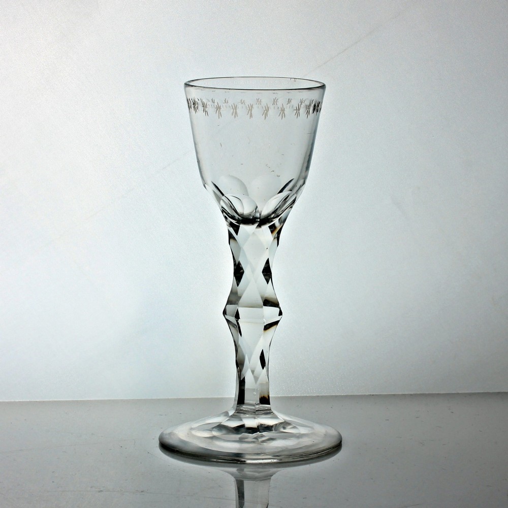 Georgian OXO-engraved facet cut knopped stem wine glass