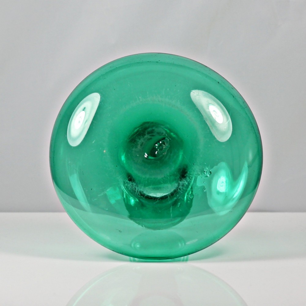 An emerald green hand-blown glass mell decanter featuring a wide flattened base and a long slender neck with a flat lip. View IV