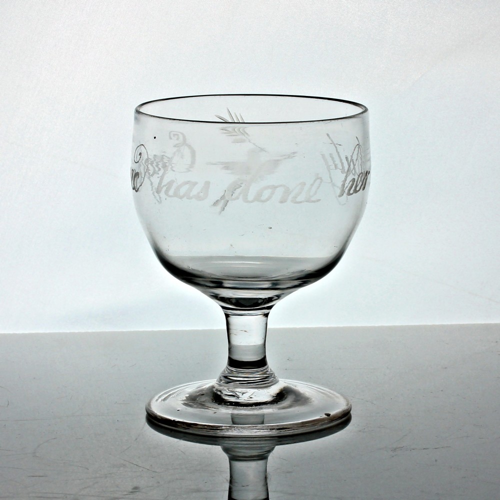 A clear Georgian glass rummer with wheel-engraved script reading England has done her duty set on a short stem and circular foot. View II