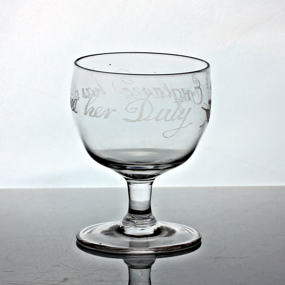A clear Georgian glass rummer with wheel-engraved script reading England has done her duty set on a short stem and circular foot. View III