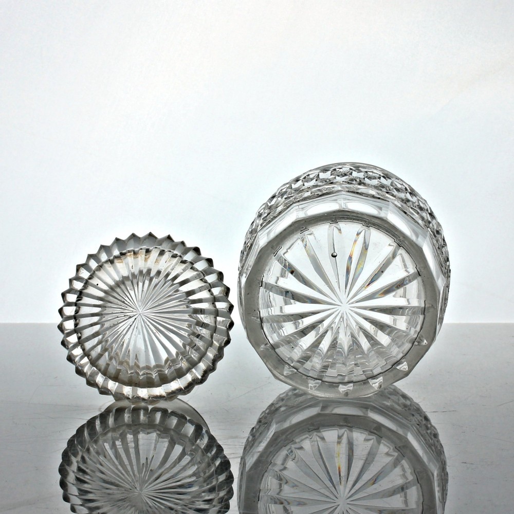 A clear Georgian cut glass cylindrical pickle jar featuring strawberry diamond cutting and a matching fitted glass lid. View III