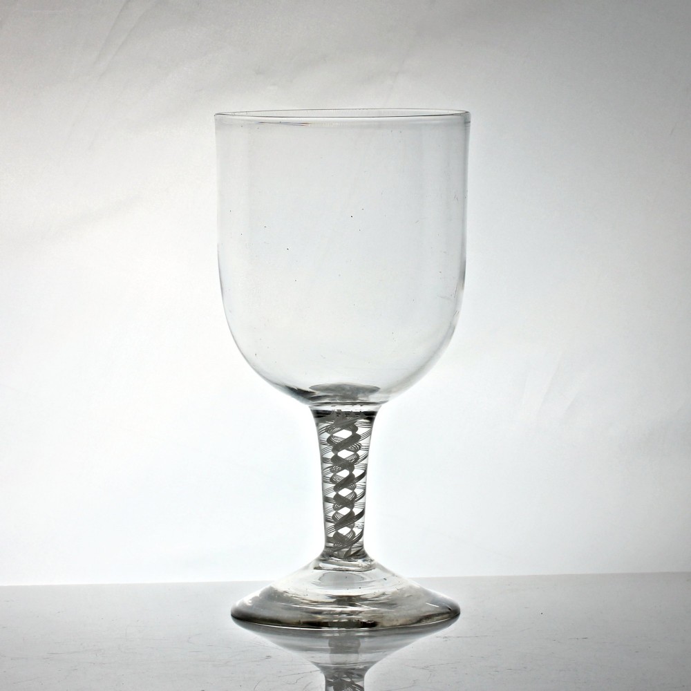 A large clear Georgian lead glass goblet featuring a double opaque twist stem and a wide flared foot. View II