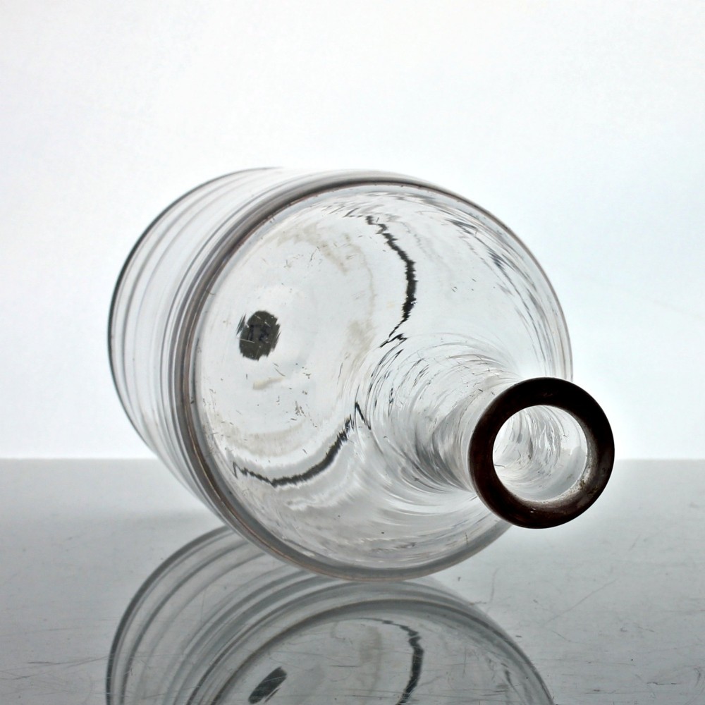 A clear lead glass Georgian shoulder carafe featuring a flared neck and five horizontal raised Lynn rings around the lower body. View II