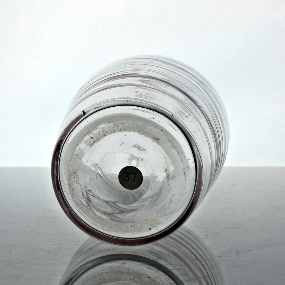 A clear lead glass Georgian shoulder carafe featuring a flared neck and five horizontal raised Lynn rings around the lower body. View III
