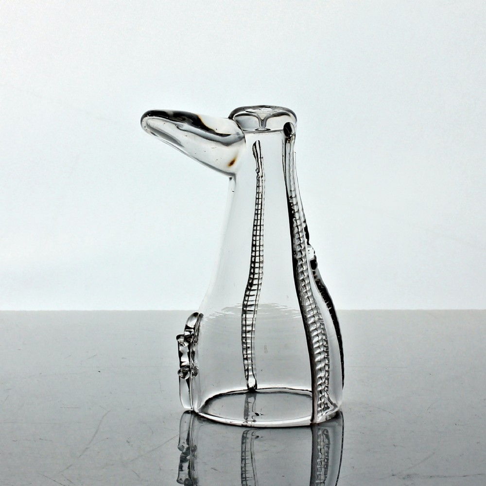 A clear hand-blown Georgian glass vessel modelled in the shape of a boot with vertical rigaree decoration. View II