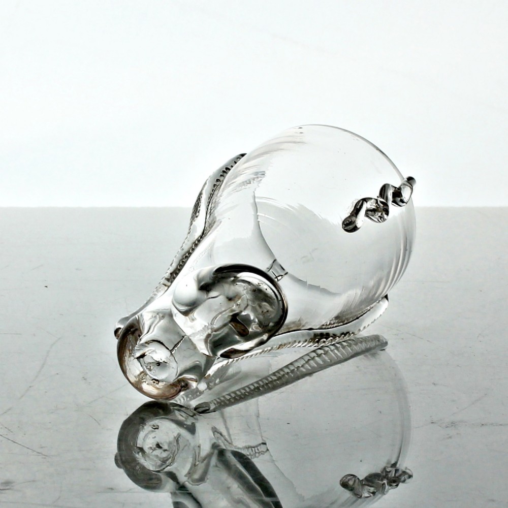 A clear hand-blown Georgian glass vessel modelled in the shape of a boot with vertical rigaree decoration. View IV