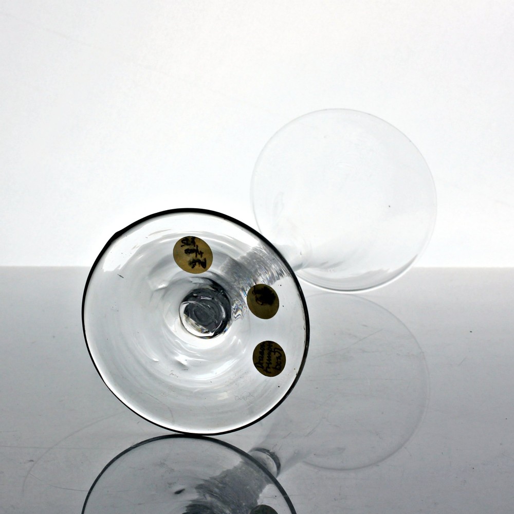 An 18th-century clear glass wine glass featuring a tall trumpet-shaped bowl, a double series opaque twist stem, and a wide conical foot. View IV