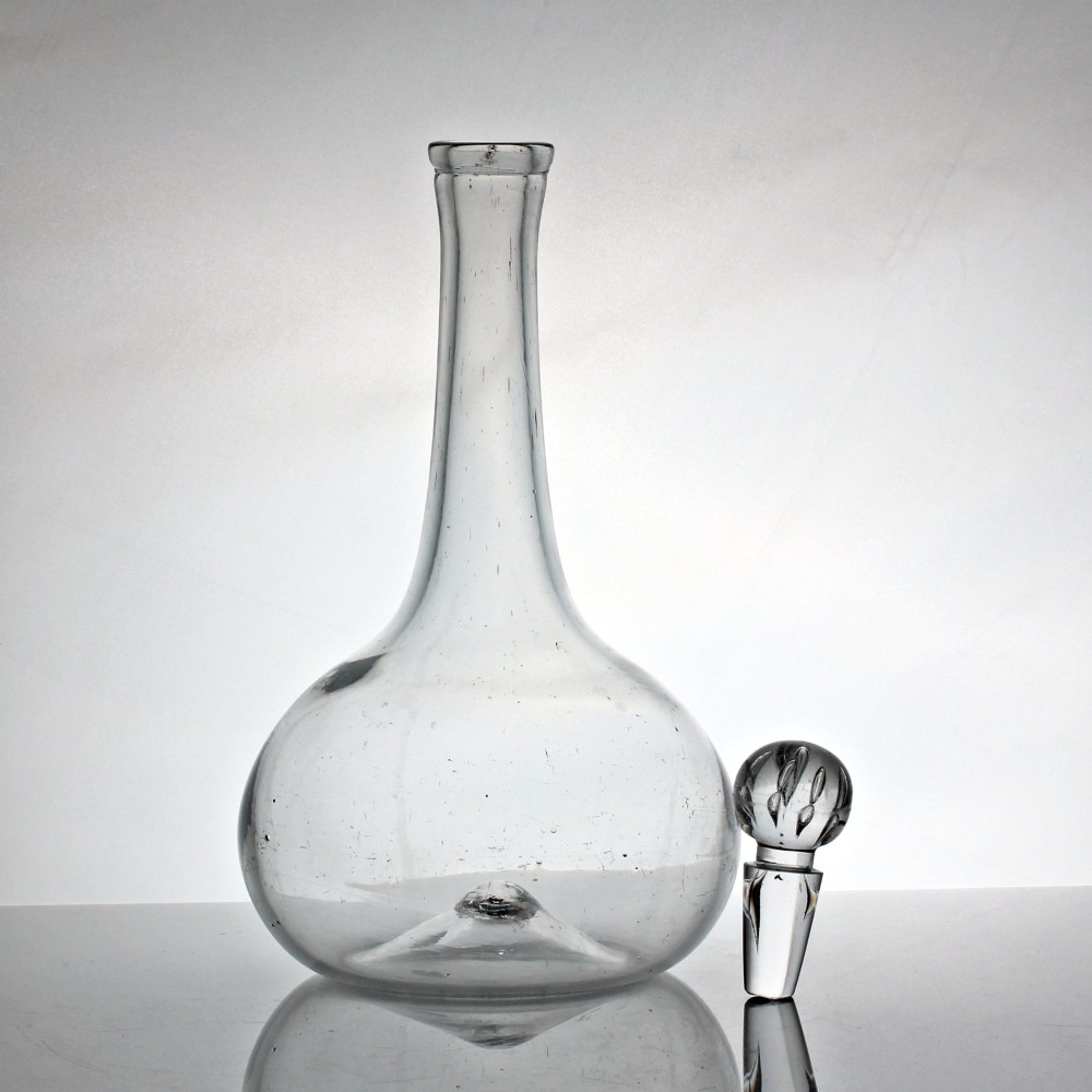 An 18th-century Georgian clear hand-blown glass shaft and globe decanter featuring a spherical base, long slender neck, and matching glass ball stopper. View II