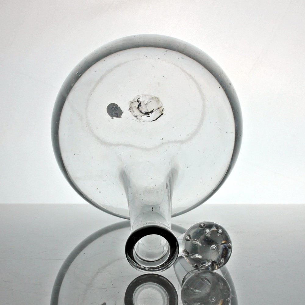 An 18th-century Georgian clear hand-blown glass shaft and globe decanter featuring a spherical base, long slender neck, and matching glass ball stopper. View III