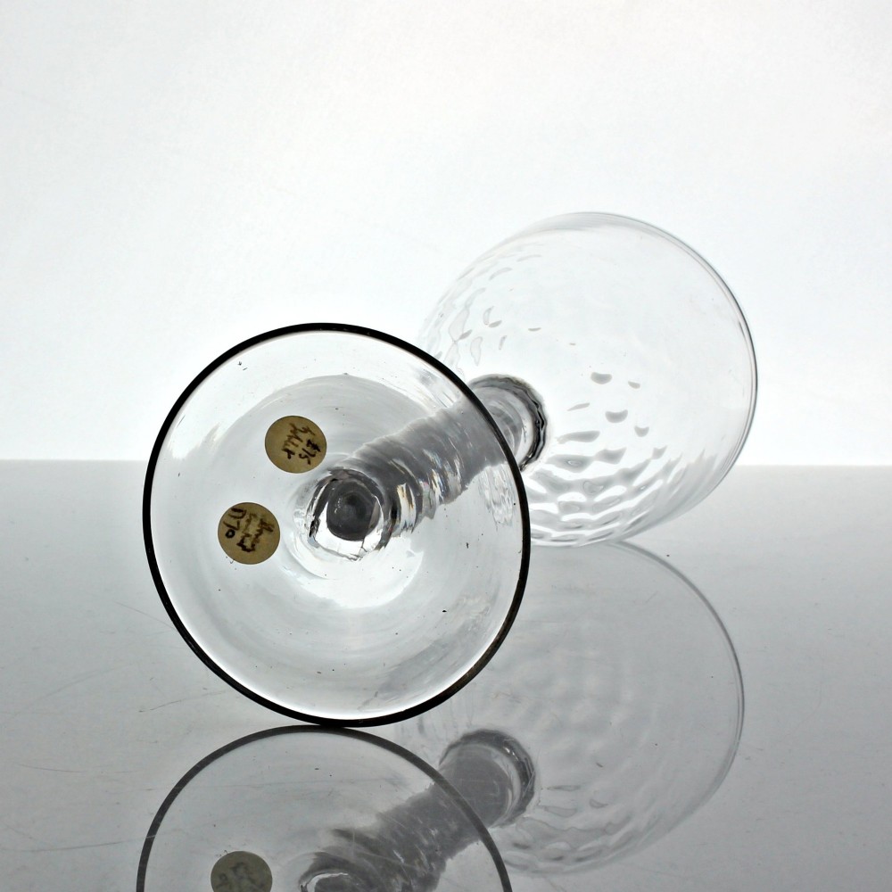 An 18th-century Georgian clear glass goblet featuring an ovoid bowl with basal mouldings, a double series opaque twist stem, and a flat conical foot. View IV