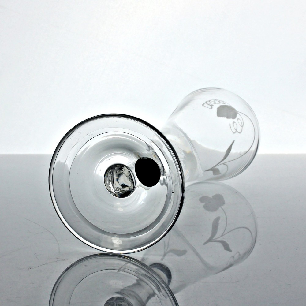 An antique clear glass ale flute featuring wheel-engraved hop and barley motifs on a tall bowl supported by a balustroid stem and folded foot. View IV