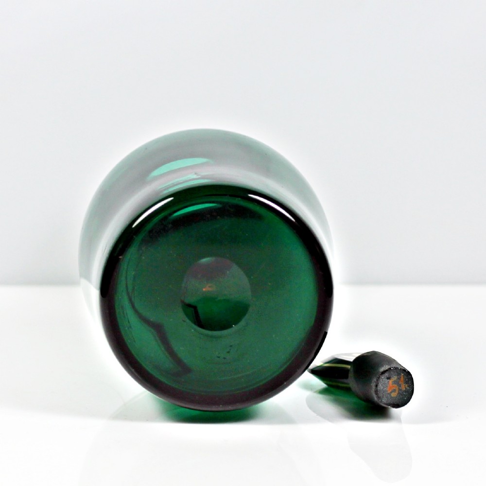 A set of three Georgian Bristol green glass decanters with gilded labels for Brandy, Hollands, and Rum, featuring monograms on the disc stoppers. View X